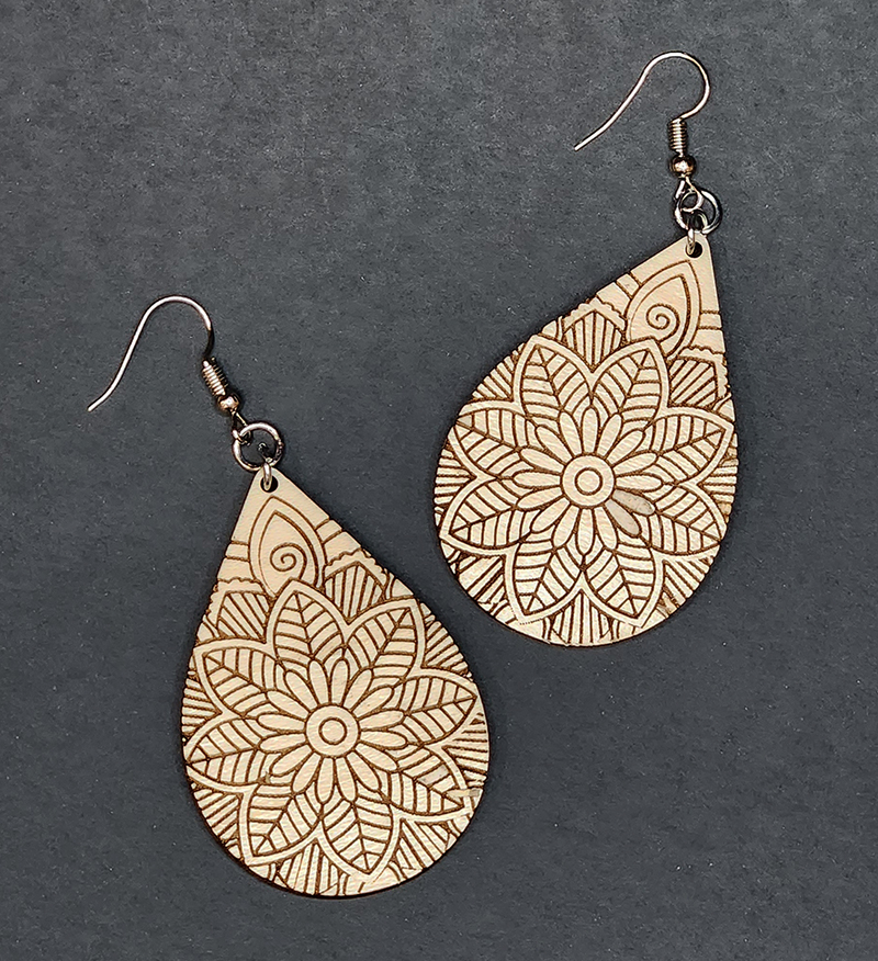 wooden dangly earrings with mandala design