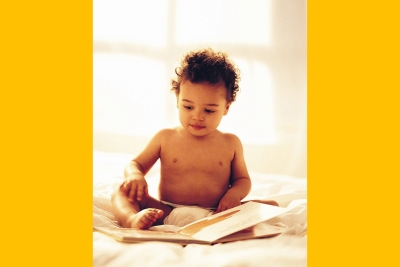 baby reading a book