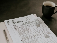 tax forms with a cup of coffee