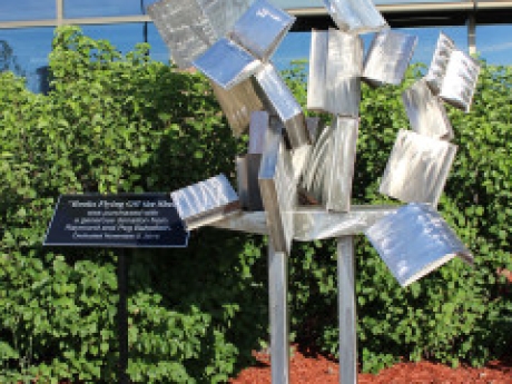 Books Flying Off the Shelf sculpture