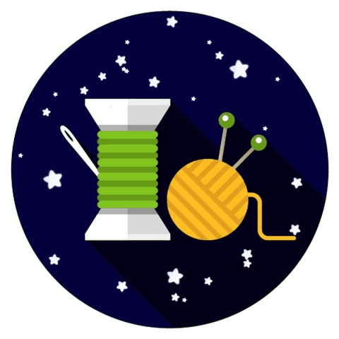 spool of green thread and yellow ball of yarn against a dark blue starry sky