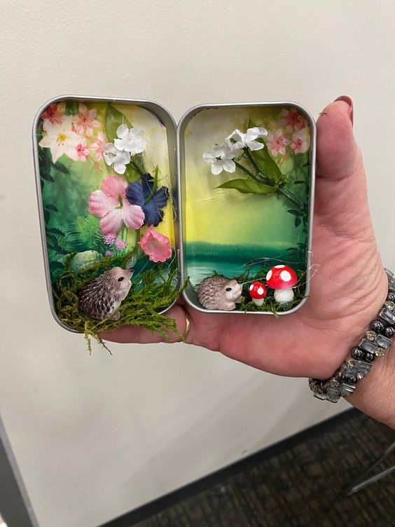 inside of a metal tin decorated with flowers and small hedgehogs