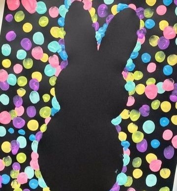 resist painting of a bunny with dots all around it