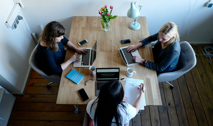 Three women meeting in a study room