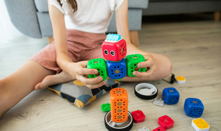 Girl playing with magnetic blocks