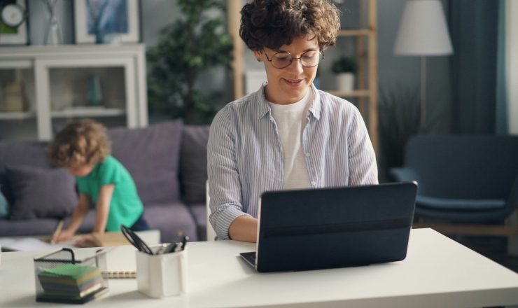 a boy using a computer and a boy drawing